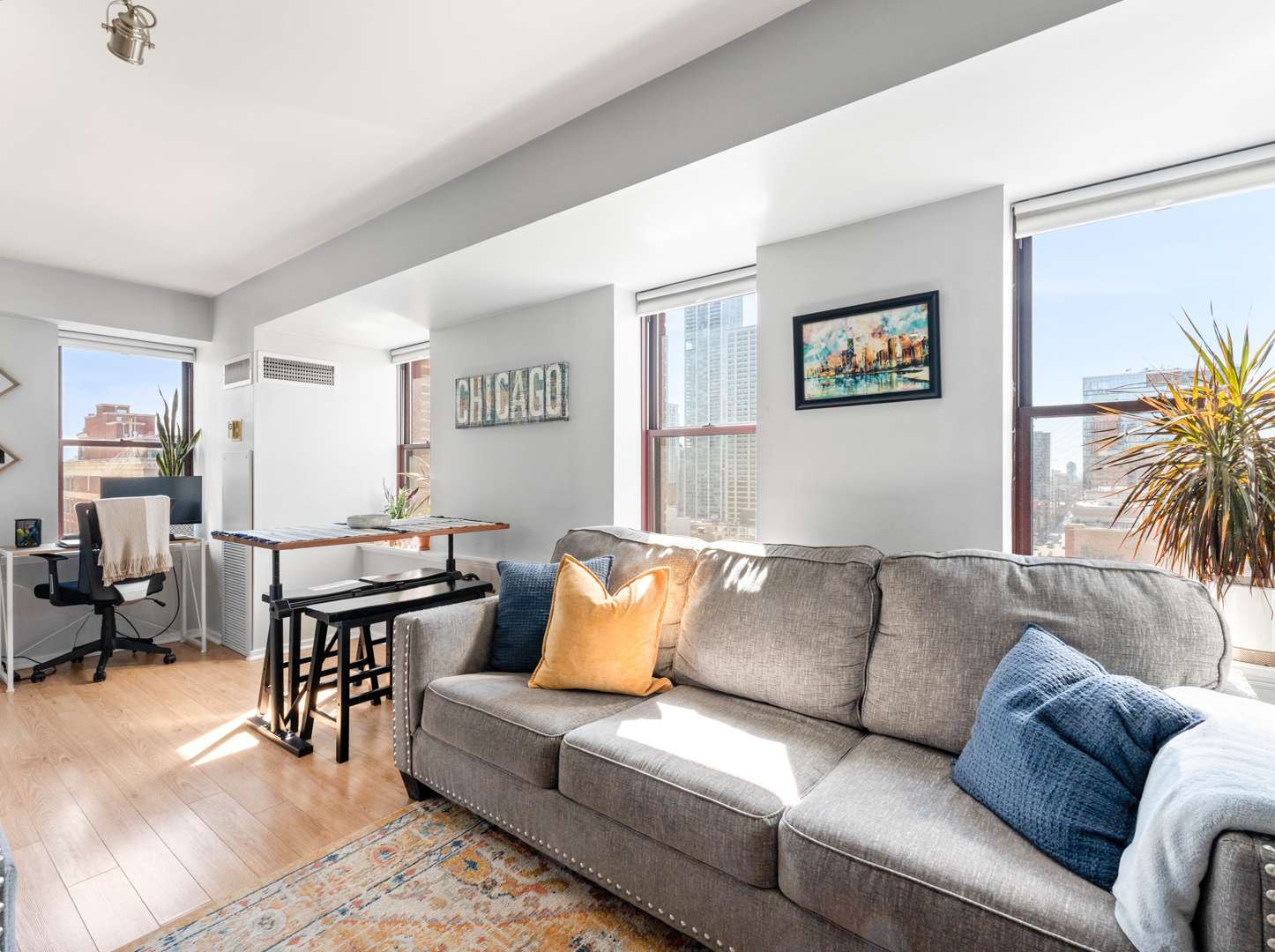 40 East 9th Street, Unit 1502 Chicago, IL 60605 - Photo 11 of 36 a living room with furniture and a couch