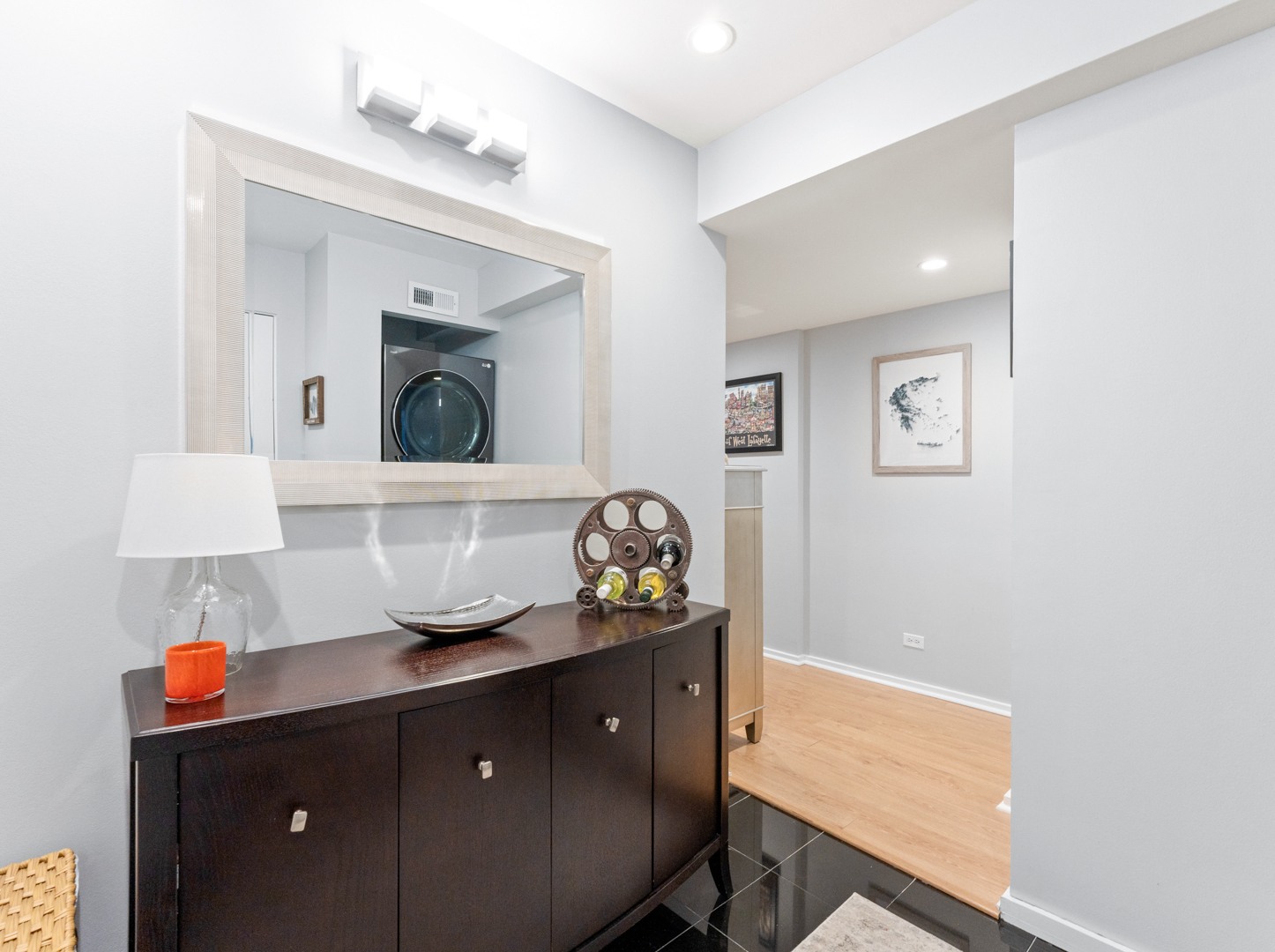 40 East 9th Street, Unit 1502 Chicago, IL 60605 - Photo 3 of 36 a bathroom with a sink vanity and mirror