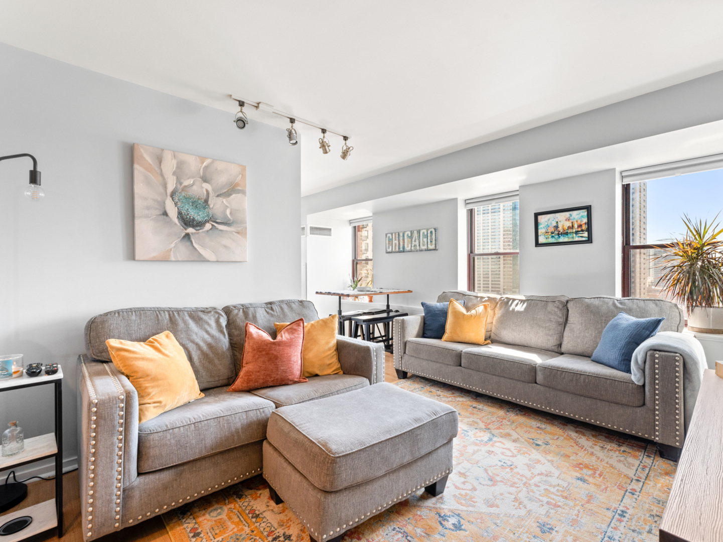 40 East 9th Street, Unit 1502 Chicago, IL 60605 - Photo 10 of 36 a living room with furniture and a couch