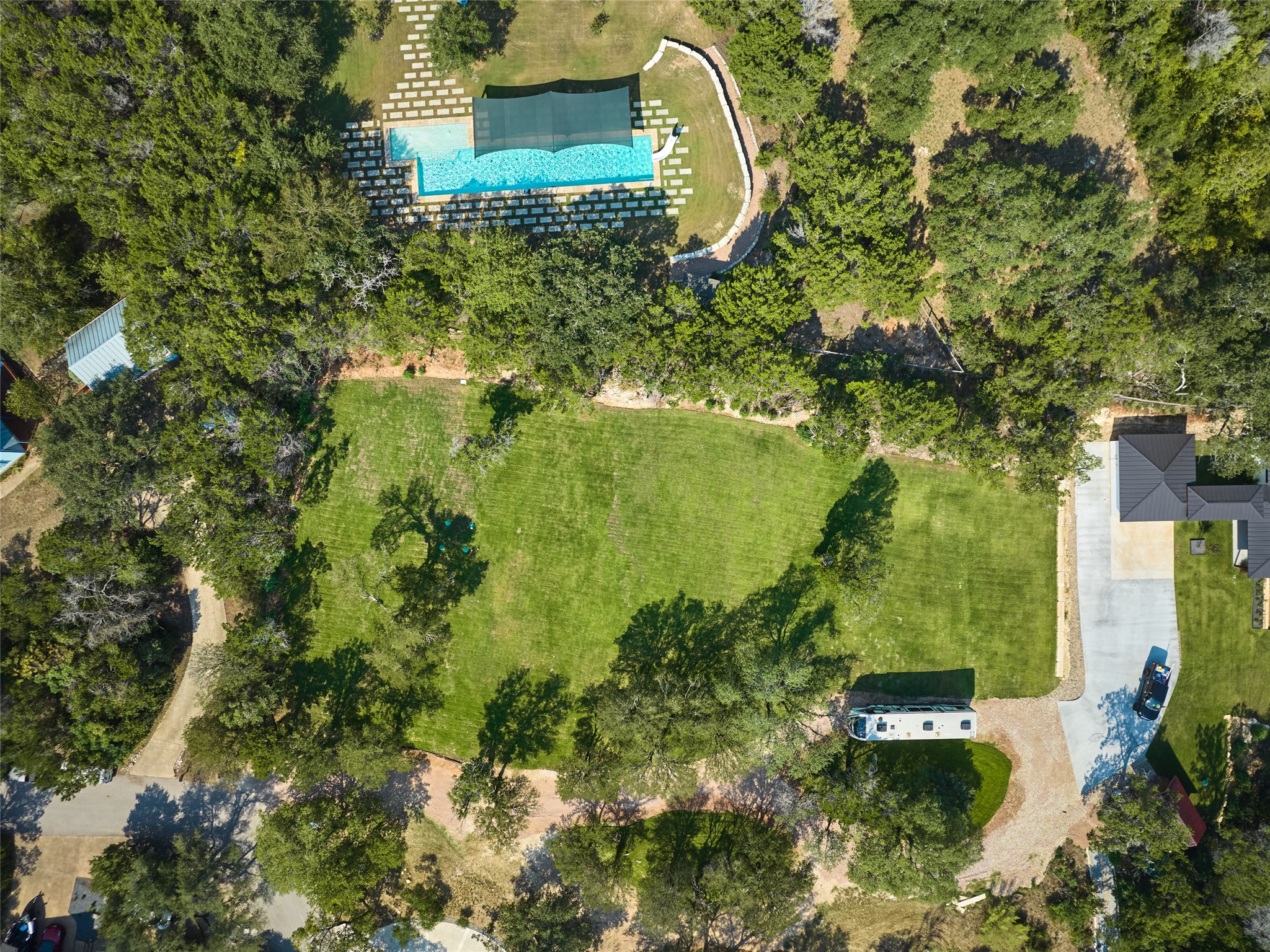 3214 Smoky Ridge, Unit LOT A Austin, TX 78730 - Photo 31 of 32 Aerial view of property and surrounding area featuring a pool area