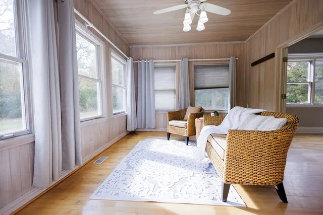 a living room with furniture and a window