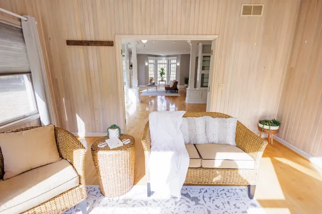 a living room with furniture and a rug