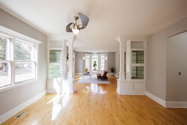 a view of a living room and hardwood floor
