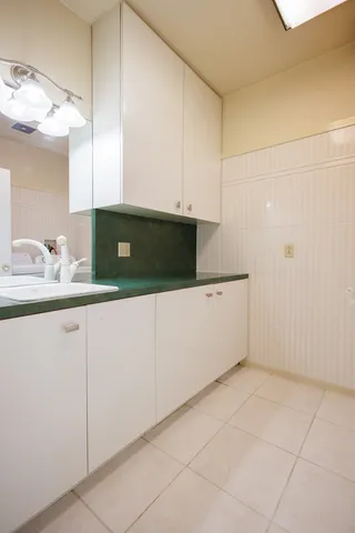 a living room with a couch and a chandelier