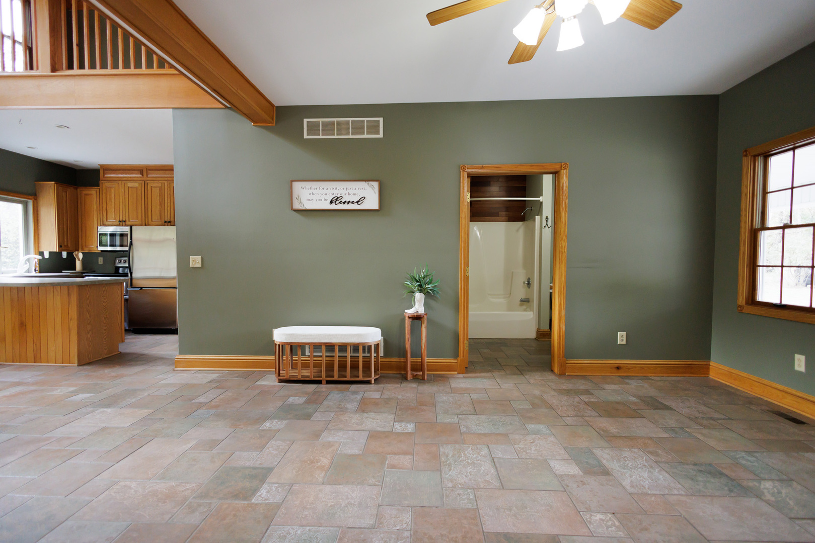 5034 East Boy Scout Road St. Anne, IL 60964 - Photo 24 of 50 a living room with a couch and a chandelier