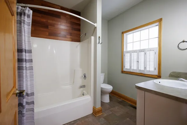a kitchen with stainless steel appliances a refrigerator sink and cabinets