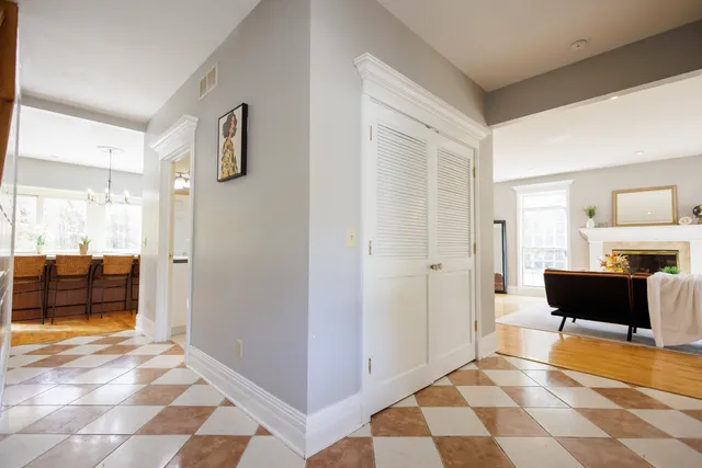 a view of a livingroom with furniture and a bedroom