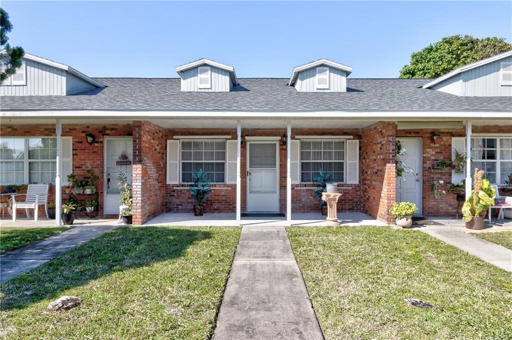 8520 Highway 1, Unit 11 Sebastian, FL 32976 - Photo 1 of 21 a front view of a building with a porch