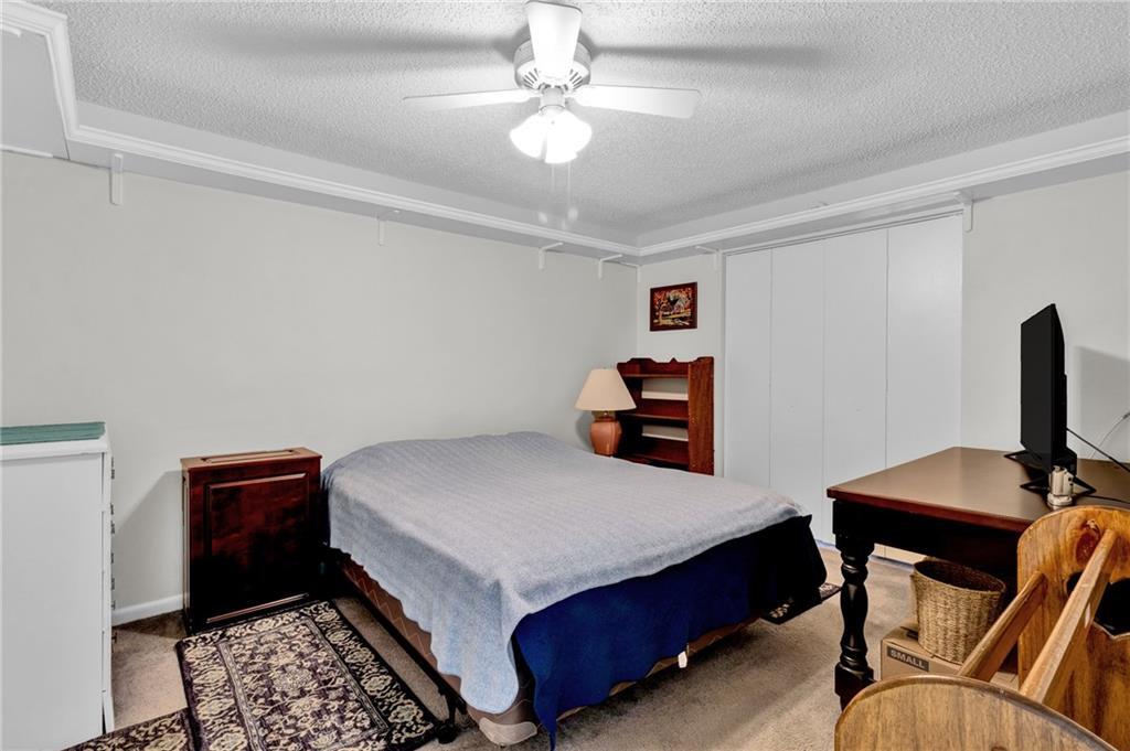 8520 Highway 1, Unit 11 Sebastian, FL 32976 - Photo 13 of 21 a bedroom with a bed and a desk