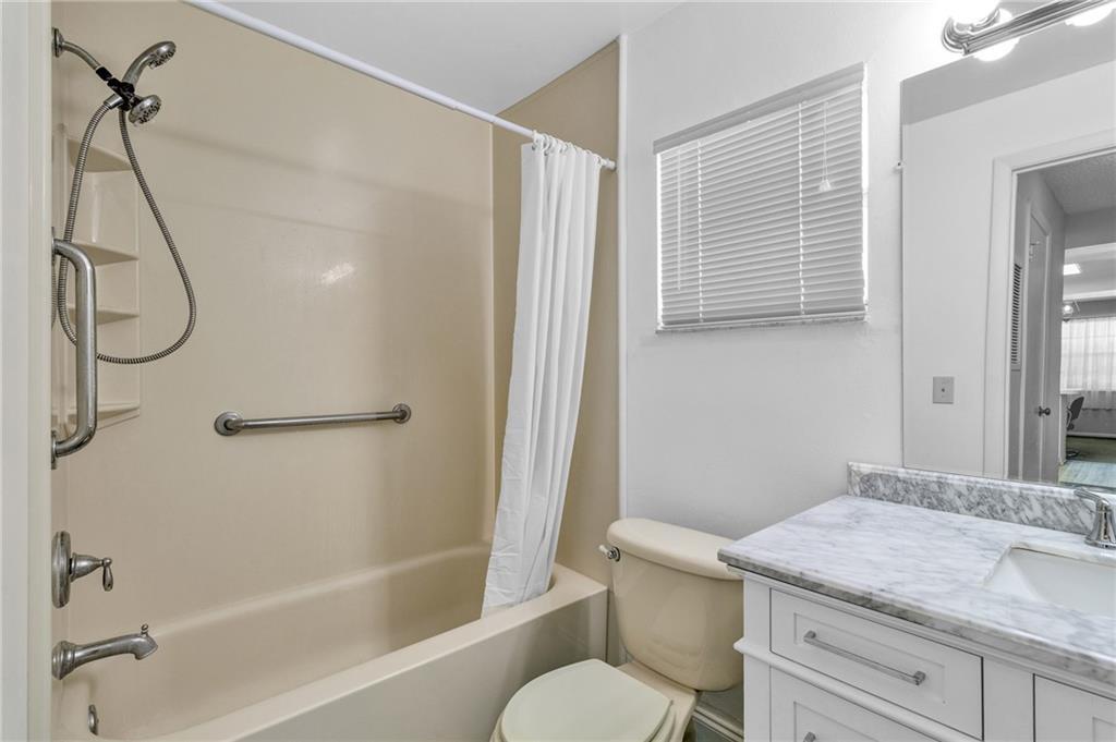 8520 Highway 1, Unit 11 Sebastian, FL 32976 - Photo 15 of 21 a bathroom with a granite countertop sink toilet and shower