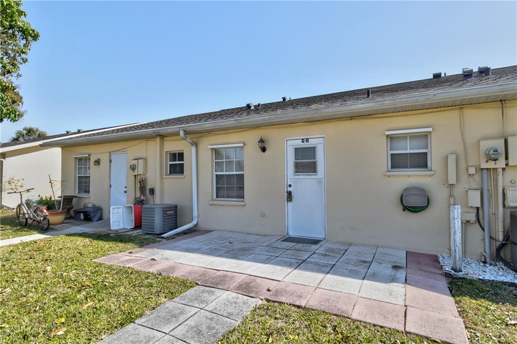 8520 Highway 1, Unit 11 Sebastian, FL 32976 - Photo 20 of 21 a front view of a house with a yard