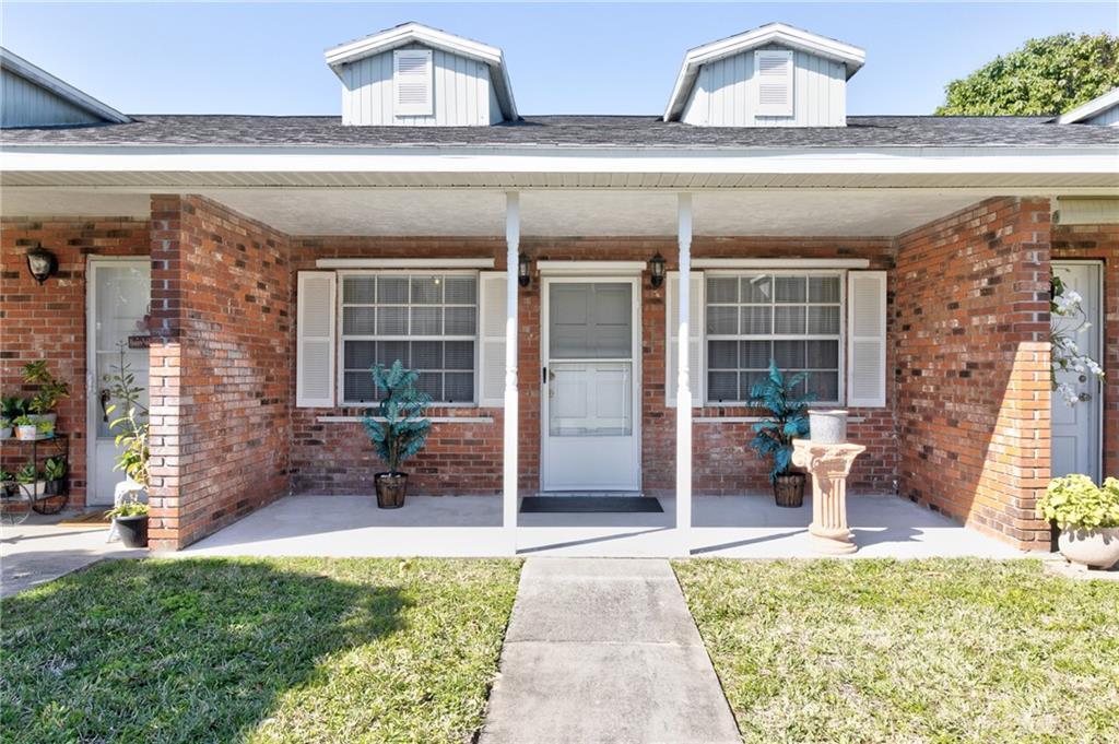 8520 Highway 1, Unit 11 Sebastian, FL 32976 - Photo 2 of 21 a front view of a house with outdoor seating