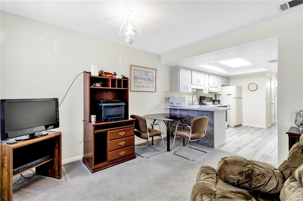 8520 Highway 1, Unit 11 Sebastian, FL 32976 - Photo 10 of 21 a living room with furniture and a flat screen tv