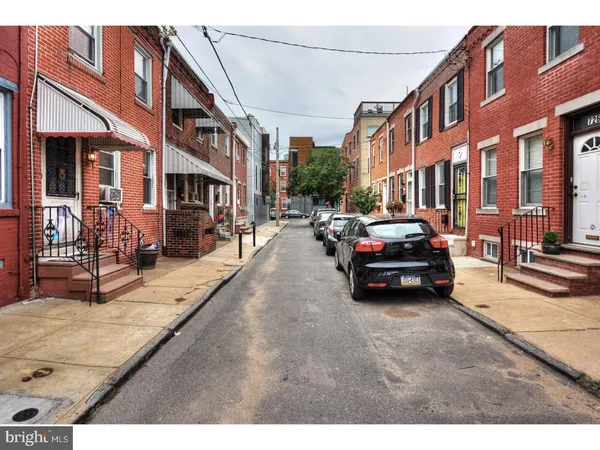 a front view of a house with car parked