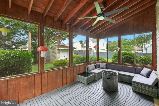 a view of balcony with couch and chairs