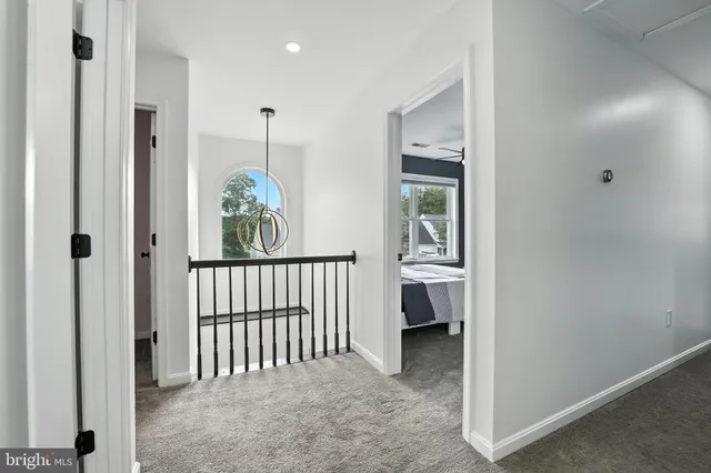 a view of a hallway with closet and entryway