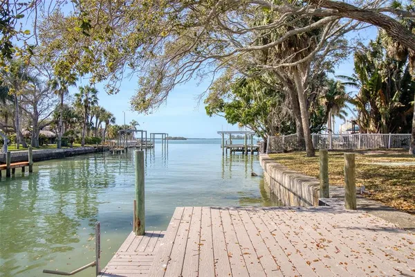 a lake view with a wooden bridge