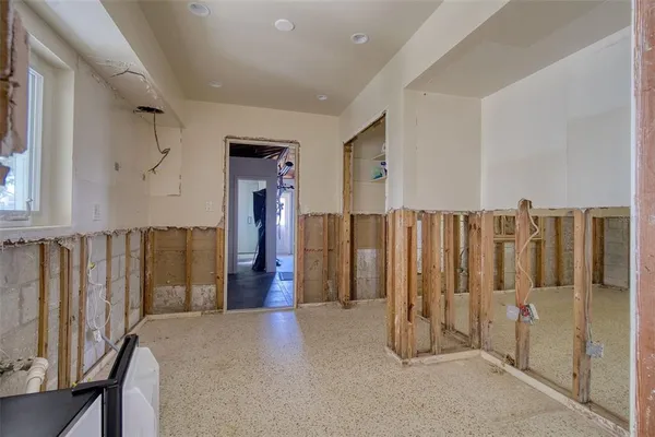 a view of hallway with wooden floor