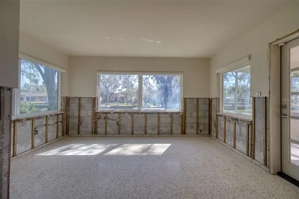 a view of a kitchen with a dishwasher and a large window