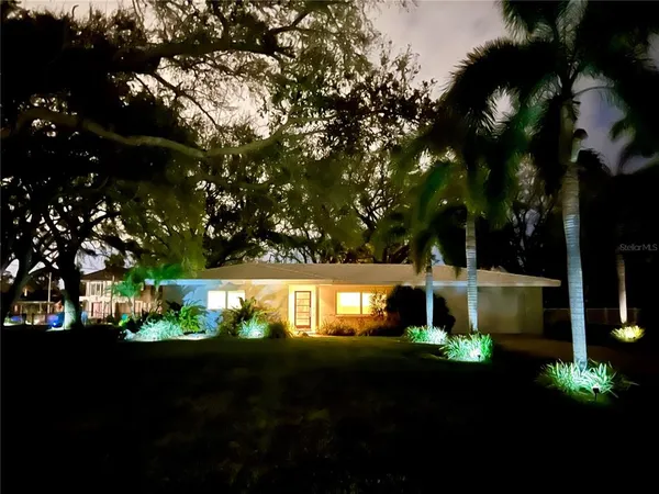 a view of house with outdoor space and sitting area