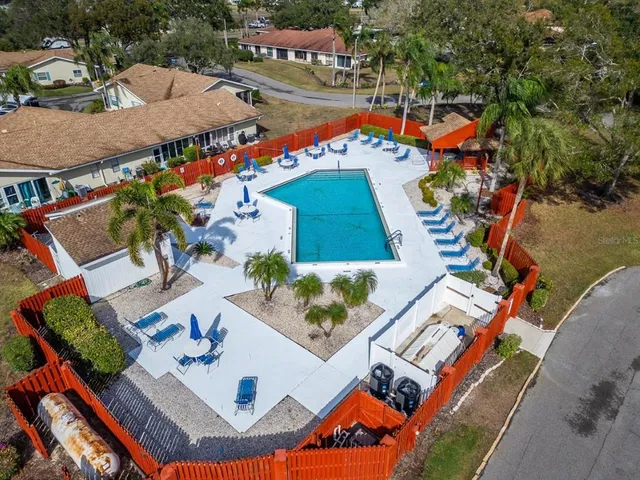 an aerial view of a house with outdoor space