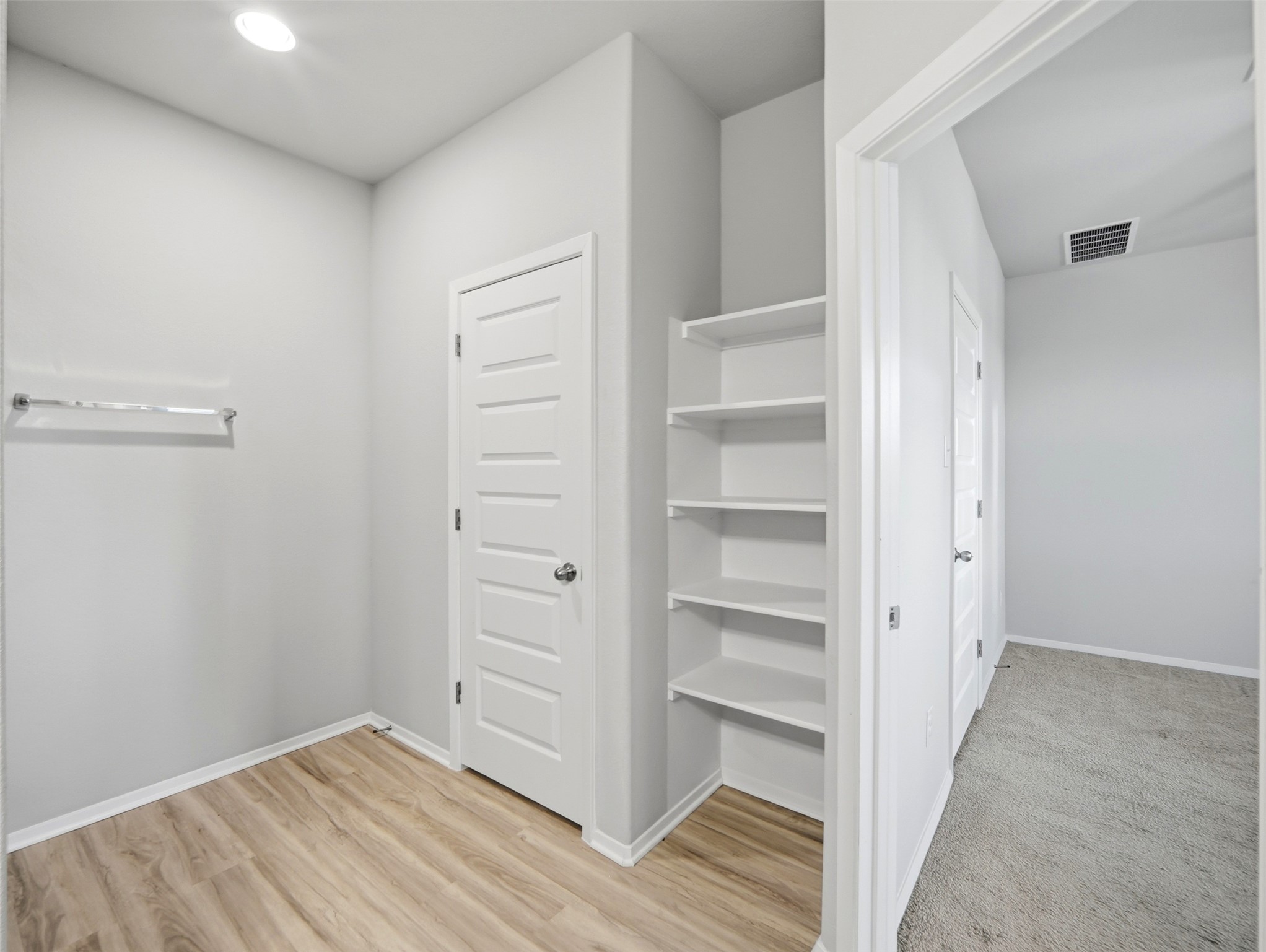60 Bent Trl Lane Georgetown, TX 78628 - Photo 24 of 40 Ample shelving and wardrobe space offer versatile storage solutions within this well-appointed closet.