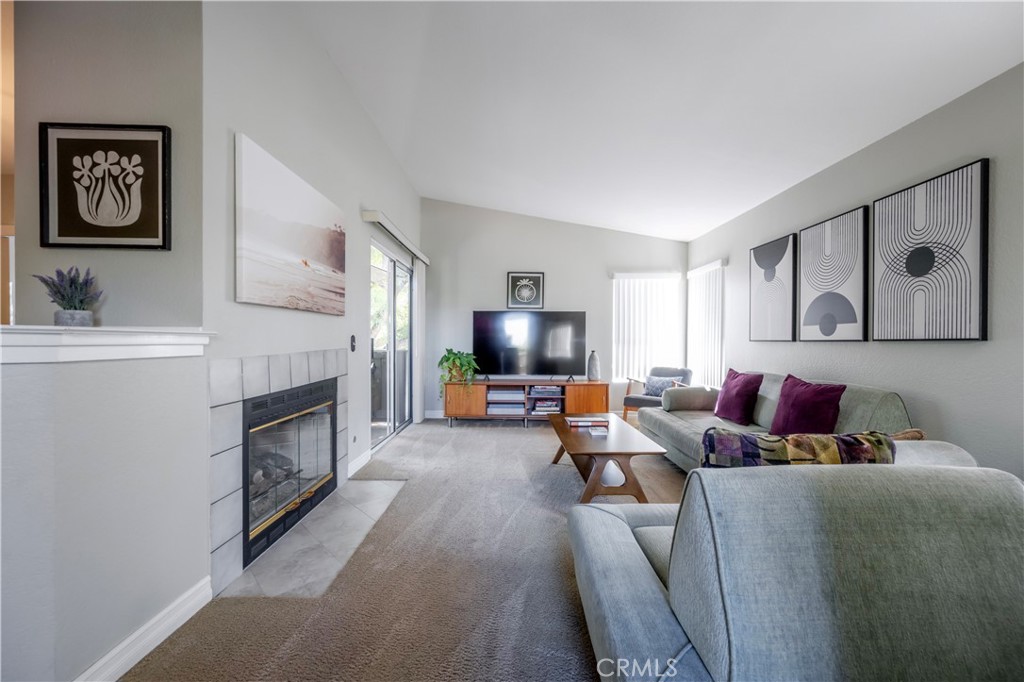 10 Corniche Drive, Unit E Dana Point, CA 92629 - Photo 1 of 25 a living room with furniture and a flat screen tv
