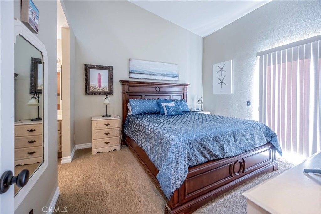 10 Corniche Drive, Unit E Dana Point, CA 92629 - Photo 12 of 25 a living room with a bed and a dresser