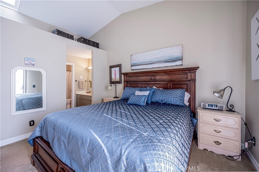 10 Corniche Drive, Unit E Dana Point, CA 92629 - Photo 13 of 25 a bedroom with a bed and a dresser