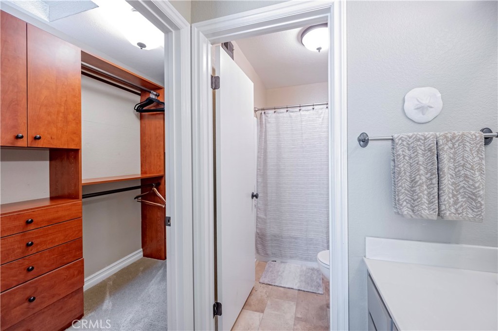 10 Corniche Drive, Unit E Dana Point, CA 92629 - Photo 16 of 25 a bathroom with a tub and shower