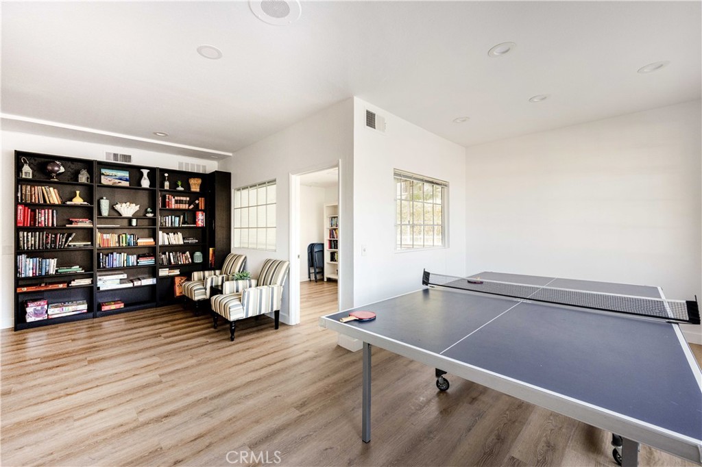 10 Corniche Drive, Unit E Dana Point, CA 92629 - Photo 24 of 25 a living room with furniture a rug and a large window