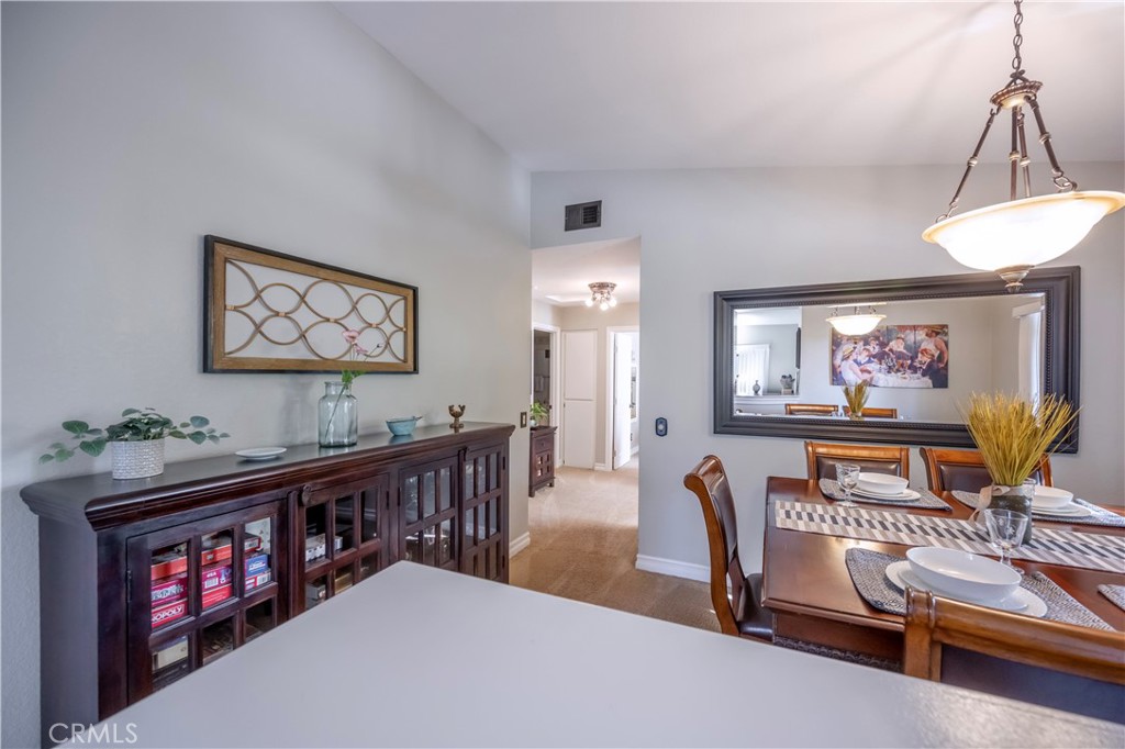 10 Corniche Drive, Unit E Dana Point, CA 92629 - Photo 5 of 25 a living room with furniture and a flat screen tv