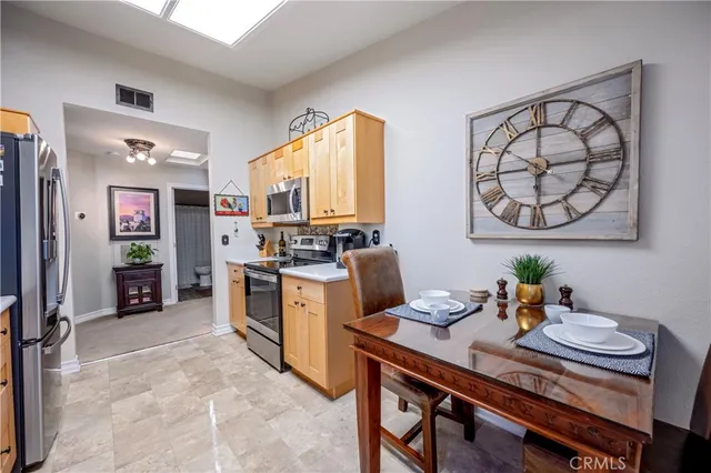 a kitchen with a sink cabinets and window