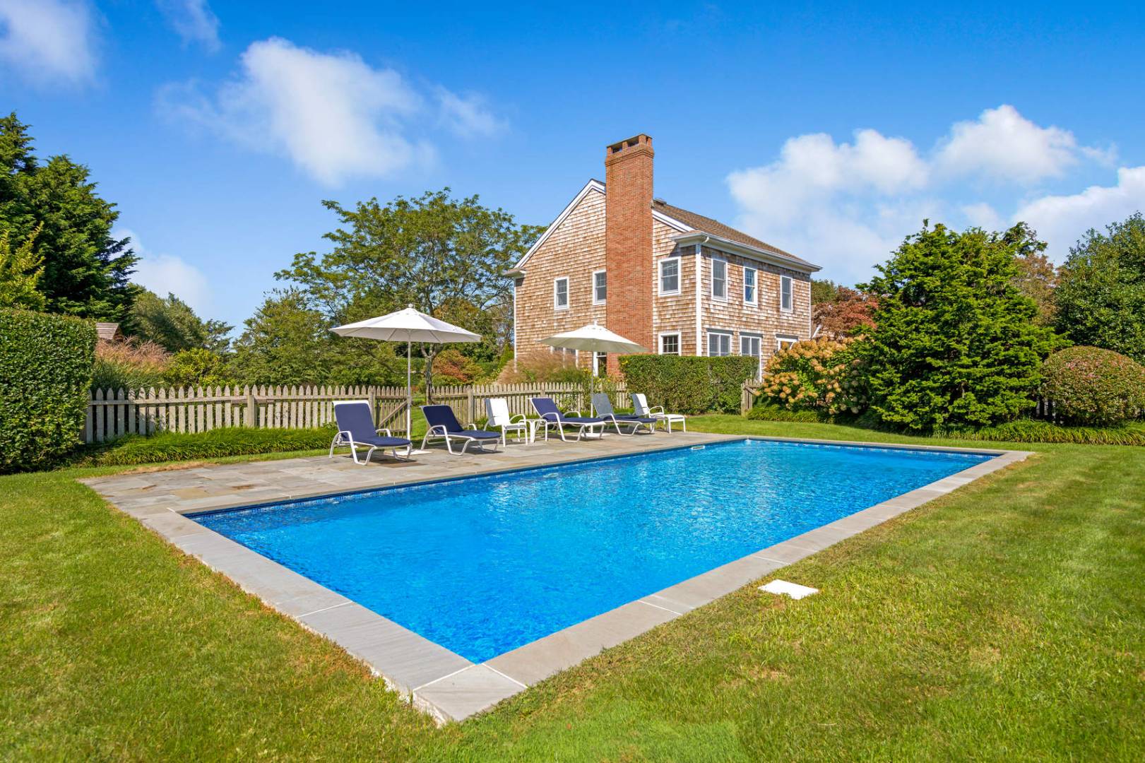 760 North Sea Mecox Road Southampton, NY 11968 - Photo 2 of 24 a view of a house with swimming pool and sitting area