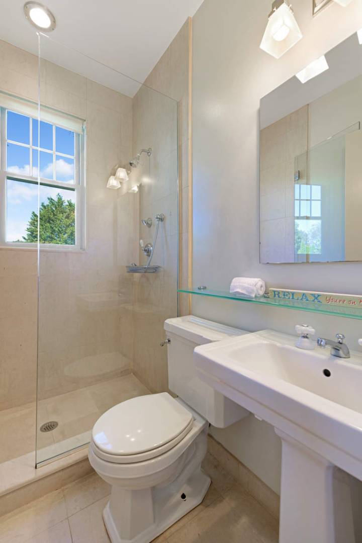 760 North Sea Mecox Road Southampton, NY 11968 - Photo 11 of 24 a bathroom with a sink a toilet and shower