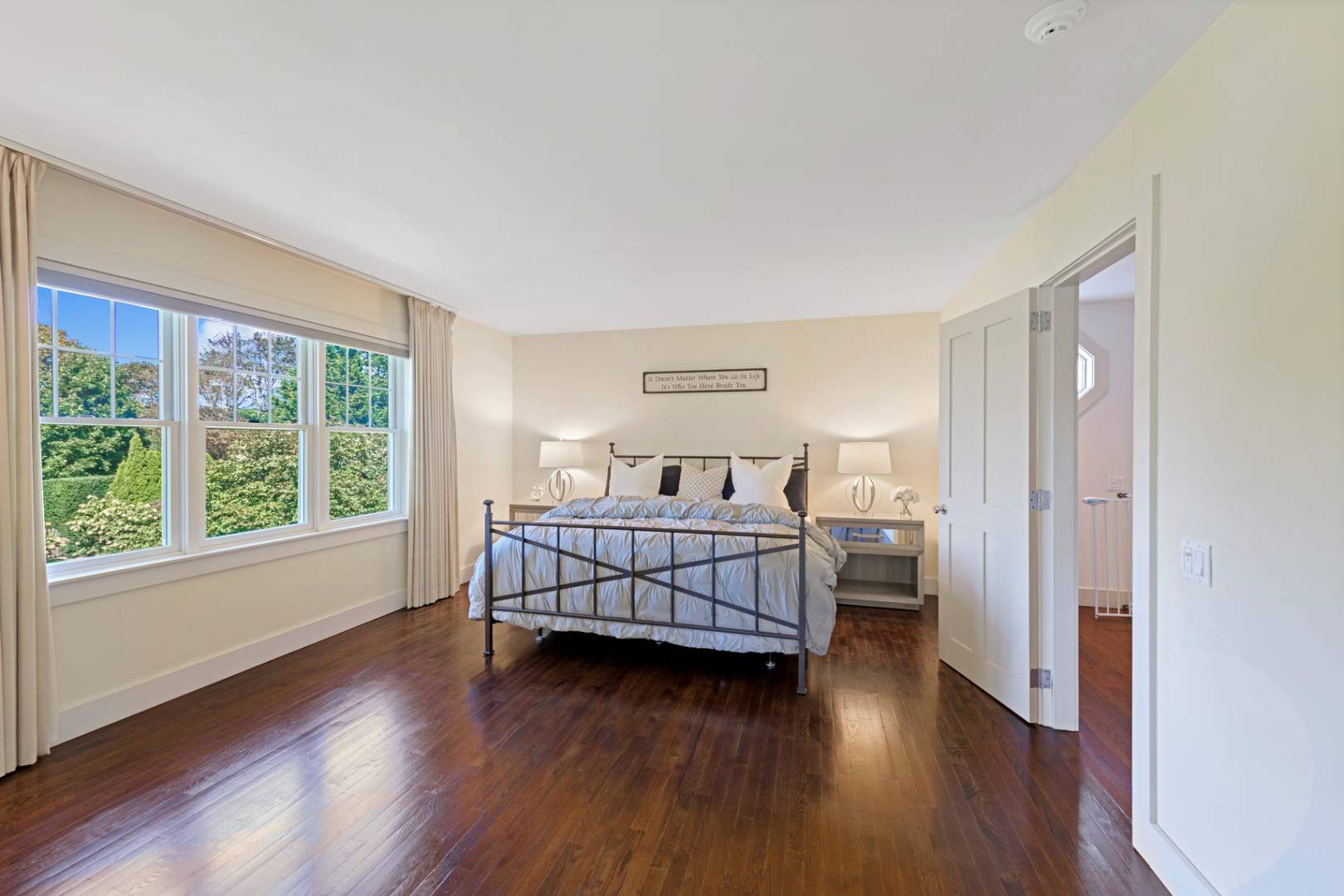 760 North Sea Mecox Road Southampton, NY 11968 - Photo 12 of 24 a bedroom with a bed and wooden floor