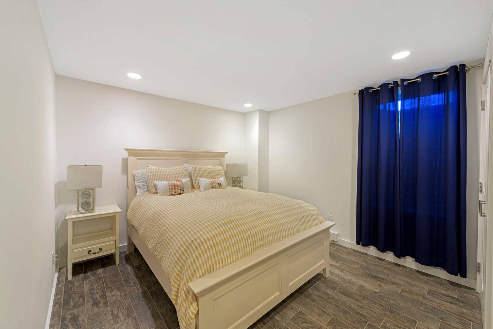 760 North Sea Mecox Road Southampton, NY 11968 - Photo 20 of 24 a bedroom with a bed and a night stand