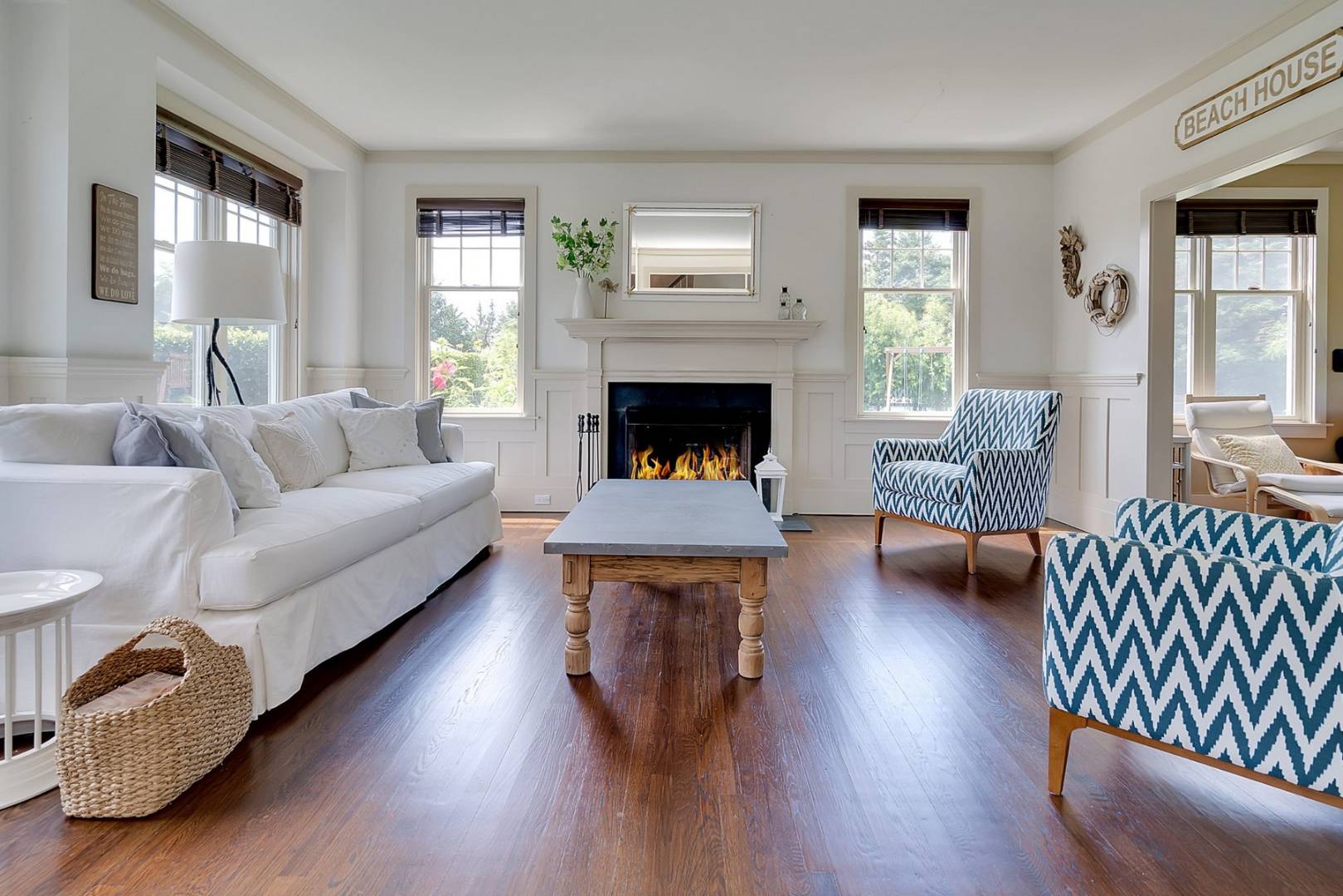 760 North Sea Mecox Road Southampton, NY 11968 - Photo 5 of 24 a living room with furniture and a fireplace