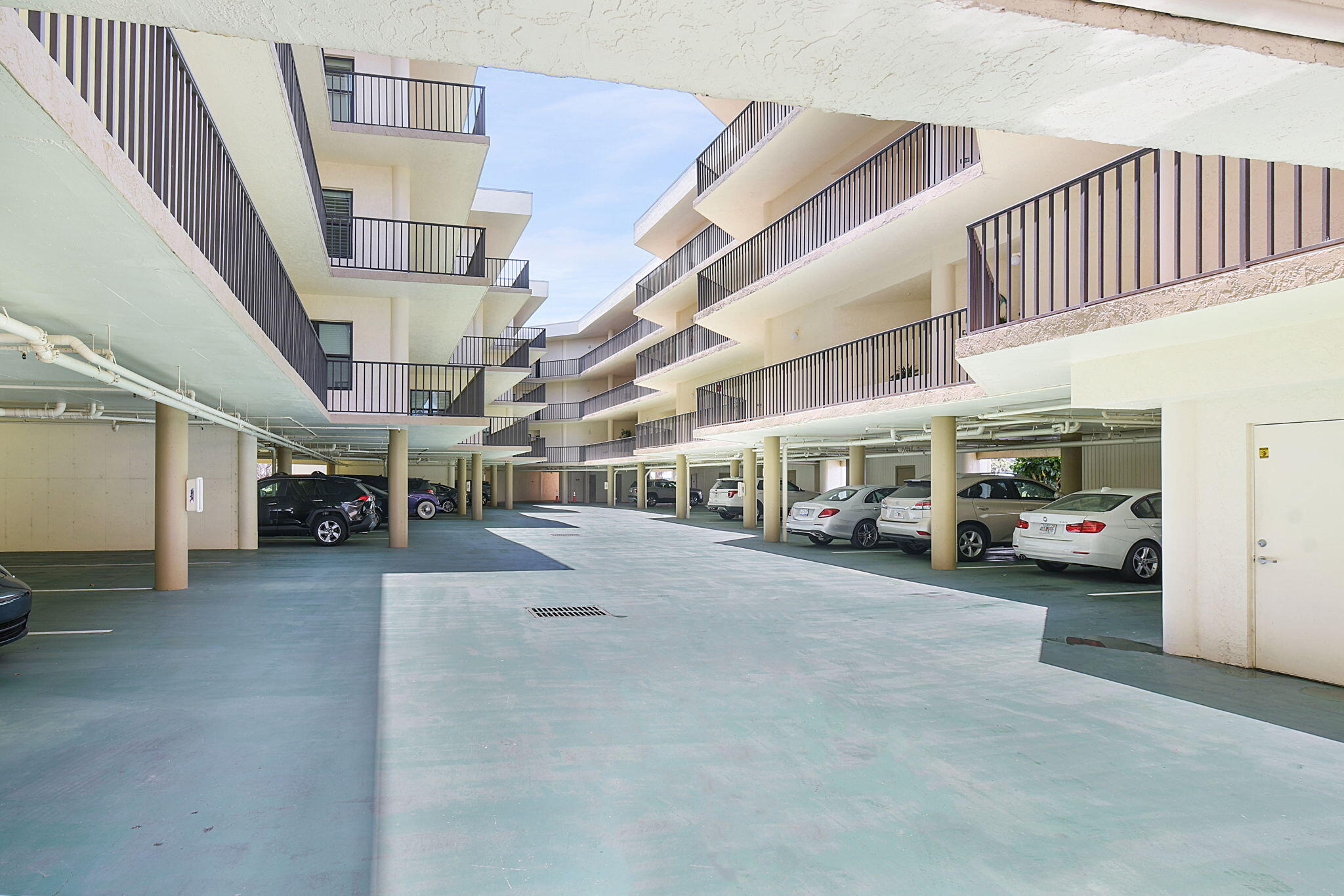 221 Northeast Plantation Road, Unit 211 Stuart, FL 34996 - Photo 25 of 32 Covered parking under building