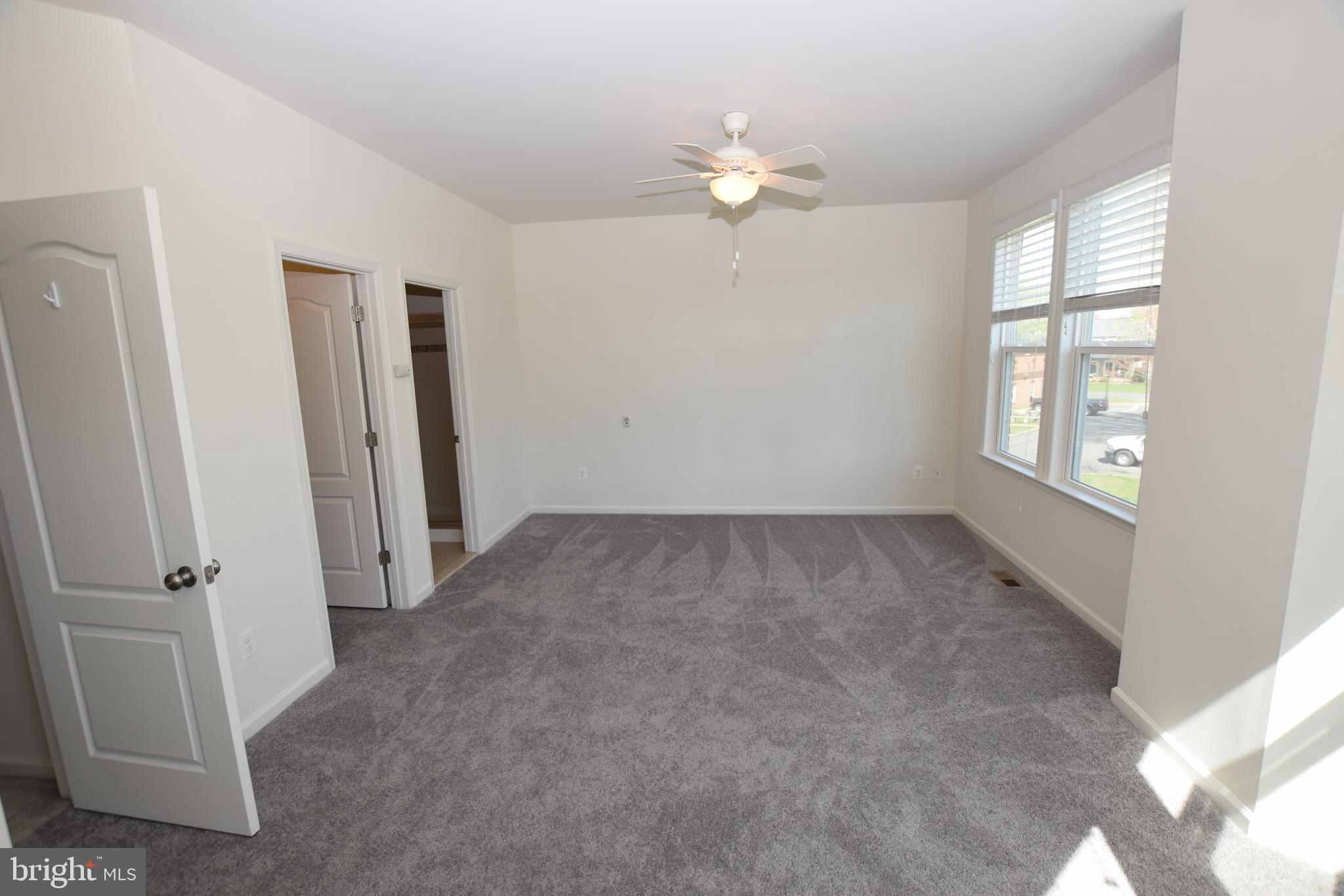 8922 Center Street Manassas, VA 20110 - Photo 11 of 24 an empty room with windows and closet