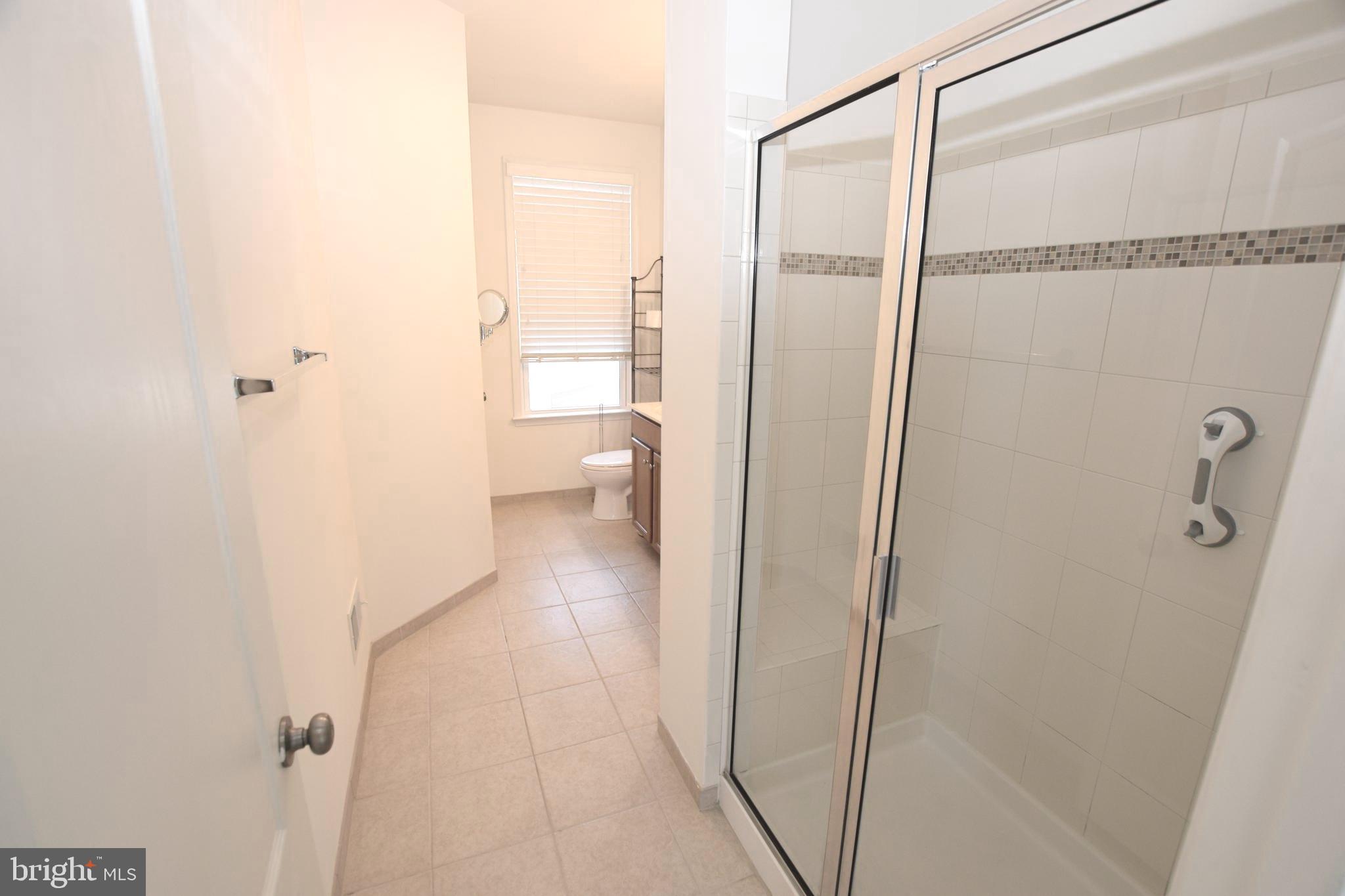 8922 Center Street Manassas, VA 20110 - Photo 14 of 24 a bathroom with a shower and a toilet
