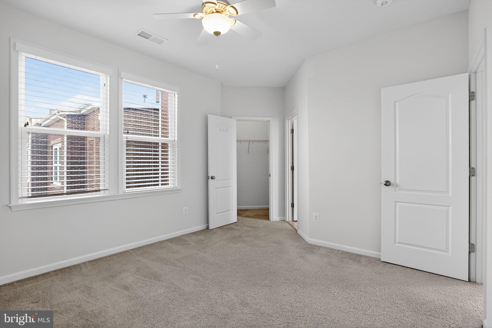 8922 Center Street Manassas, VA 20110 - Photo 18 of 24 a view of an empty room with a window