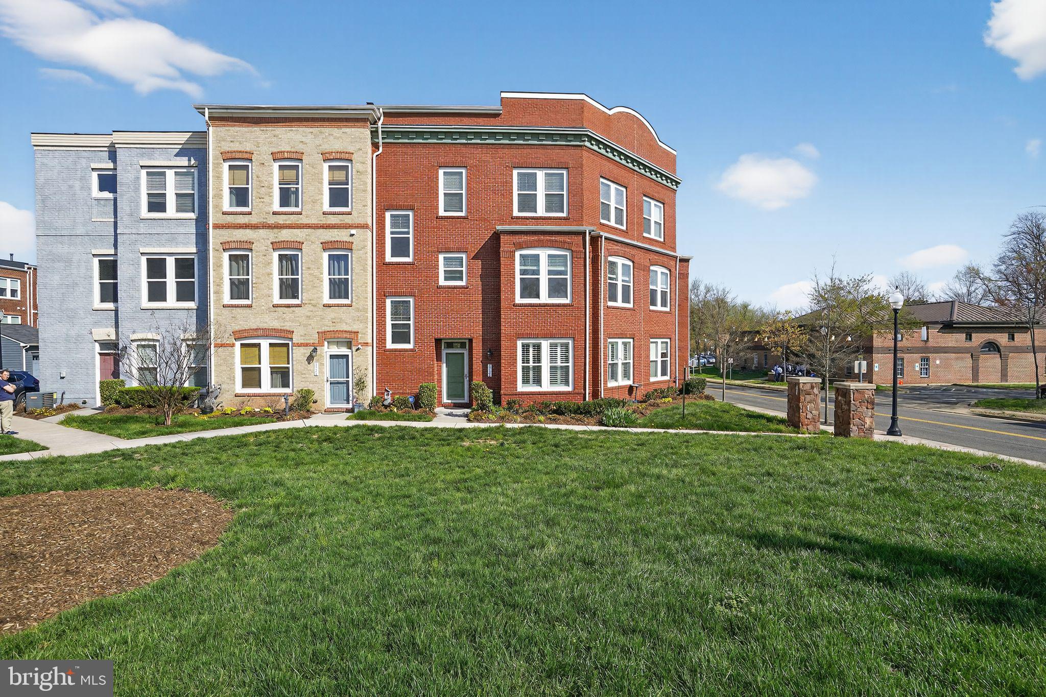 8922 Center Street Manassas, VA 20110 - Photo 2 of 24 a view of a building next to a yard