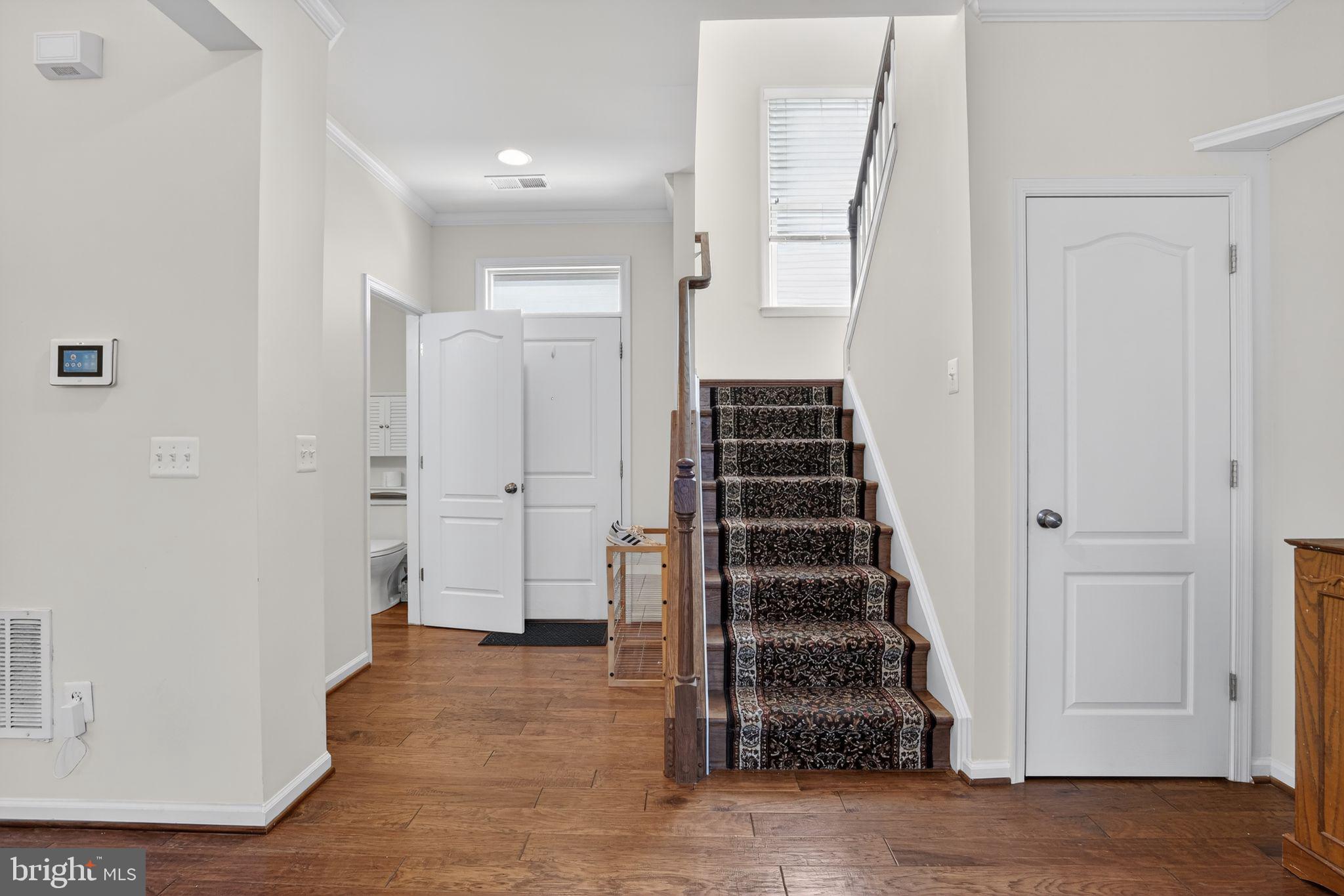 8922 Center Street Manassas, VA 20110 - Photo 9 of 24 a view of entryway with wooden floor