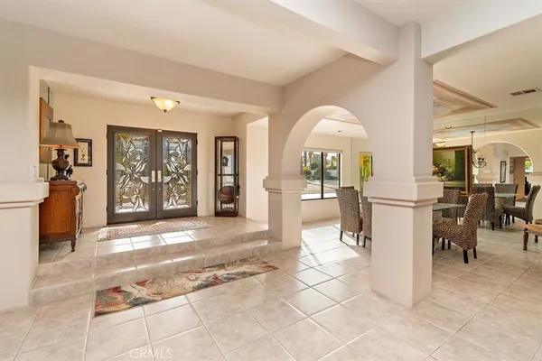 a view of a living room and entry way