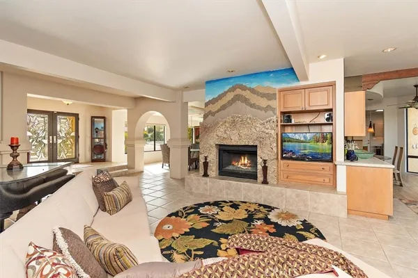 a living room with a couch and a fireplace