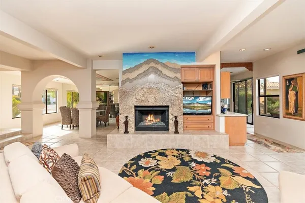 a bedroom with a bed and a fireplace