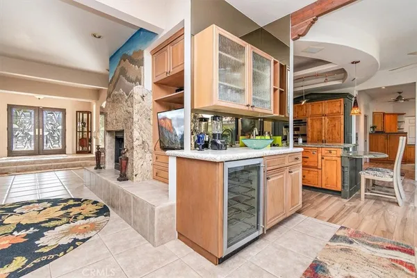 a kitchen with stainless steel appliances granite countertop a stove and a large window