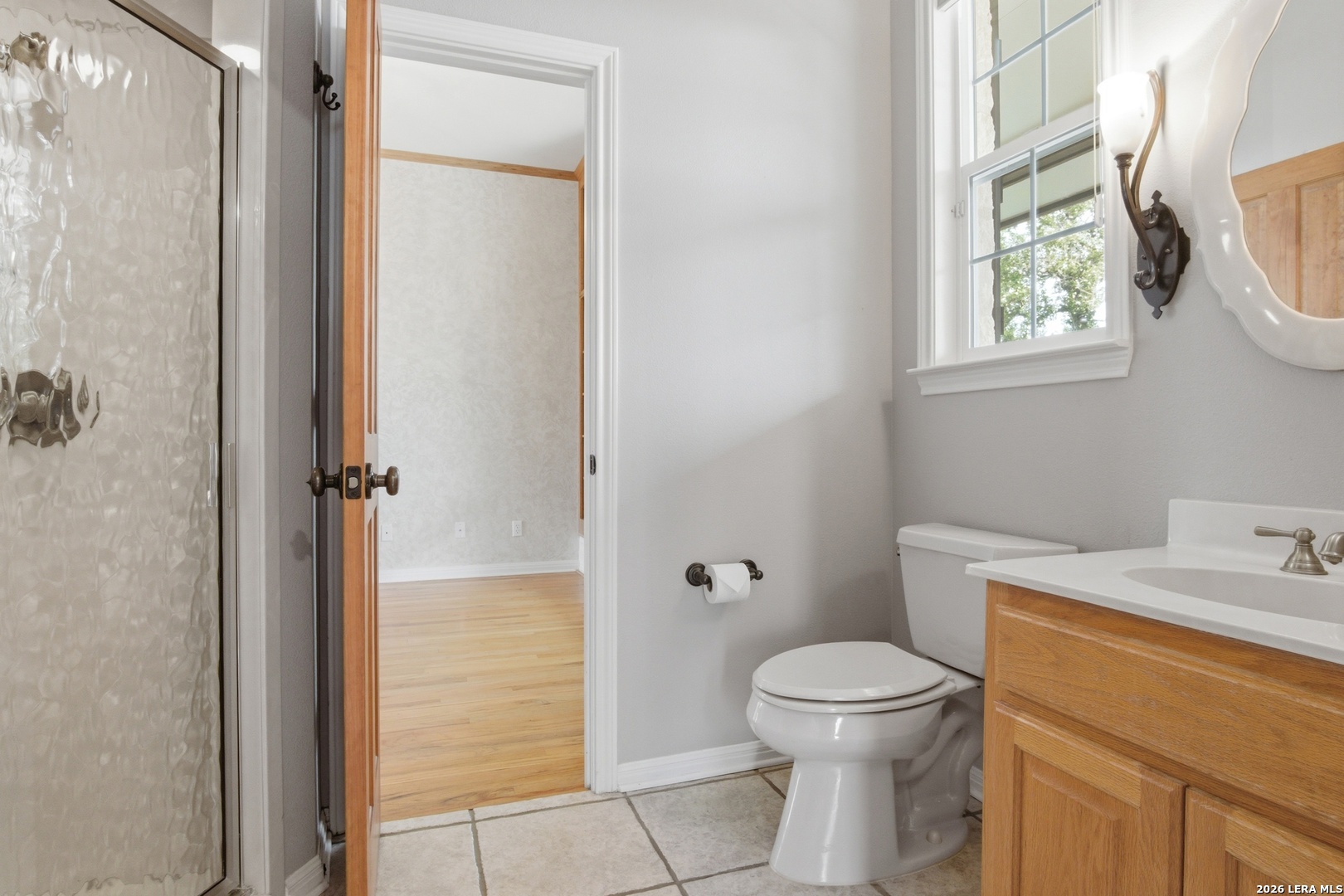 26 Seewald Road Boerne, TX 78006 - Photo 22 of 33 a bathroom with a toilet a sink and a shower