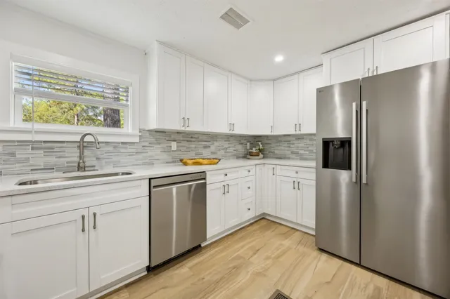 a view of a park with large trees